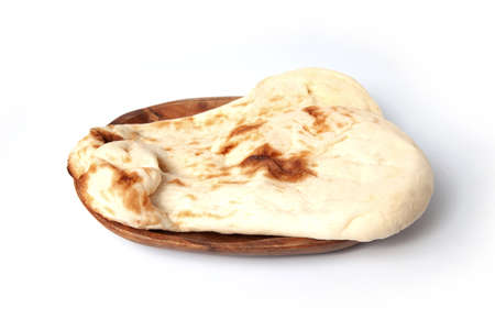 naan indian bread on plate closeup isolated on white background