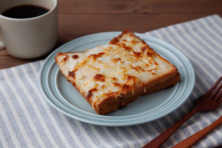 breakfast croque monsieur and hot coffee closeup isolated on table