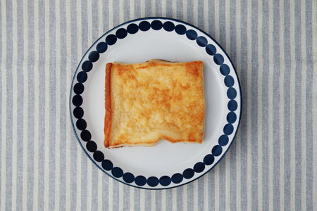 french toast on plate closeup isolated on tableの写真素材