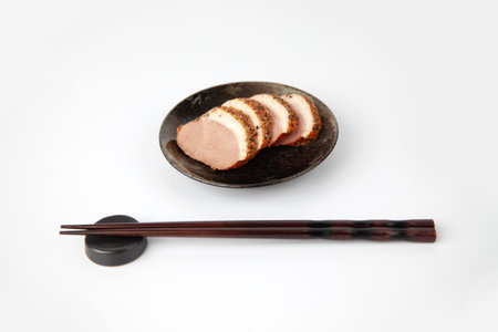 smoked duck breast slices pastrami isolated on white backgroundの写真素材
