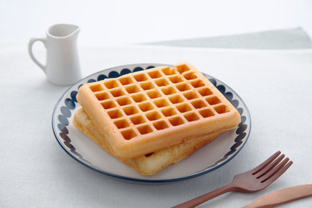 waffles pancakes on plate on tableの写真素材
