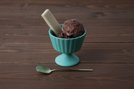 chocolate ice cream with wafer on dessert cup isolated on tableの写真素材