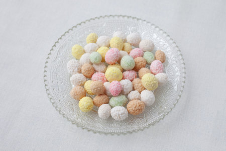 colorful roasted beans covered with sugar coating on tableの写真素材