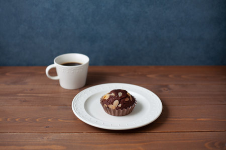 chocolate muffin with coffee on wooden tableの写真素材