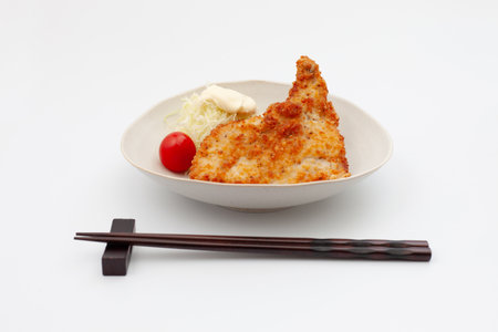 fried chicken on plate isolated on white backgroundの写真素材