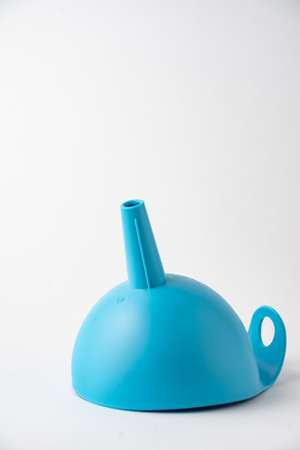 View of blue funnel on white background in vertical, with copy spaceの写真素材