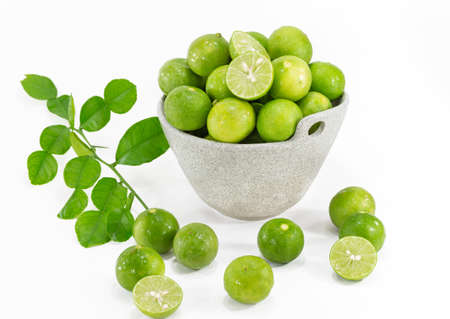 Lemons with leaf in bowl.の写真素材