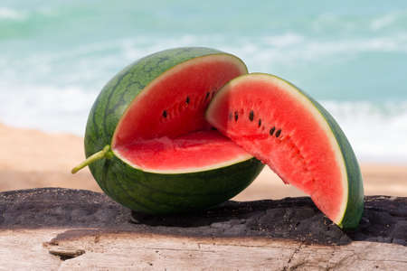 water melon on the log.の写真素材