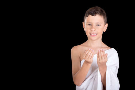 Cute Muslim Kid Praying While Wearing Ihram ( White Traditional Islamic Clothes ) During Hajjの写真素材