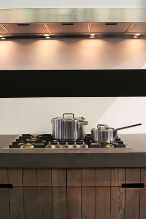 background of modern kitchen with pans and ovenの写真素材