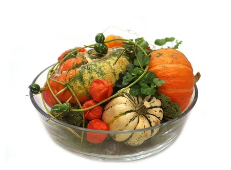 isolated pumpkins composition in glass vaseの写真素材