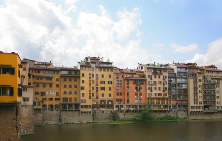 Florence old houses by lines on riverの写真素材