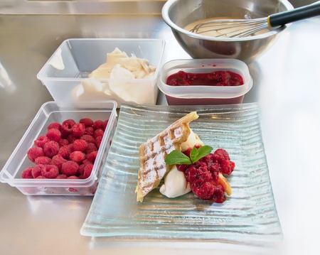 dessert preparation at a restaurant kitchenの写真素材