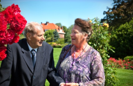 very old man (92) with his wife in summer garden の写真素材