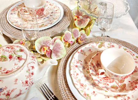 still life with decorative orchids and tea cupsの写真素材