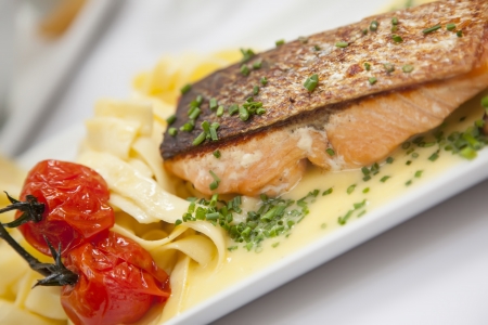 salmon plate in plate with tomatosの写真素材