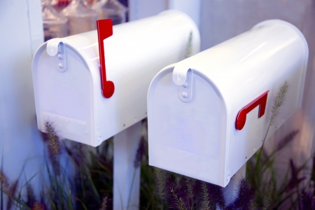 white letter boxes in seasonal gardenの写真素材