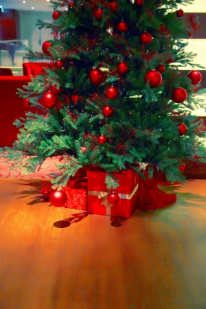Christmas tree on floor and gift boxs の写真素材