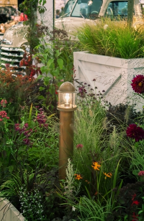 evening light in garden with retro car の写真素材