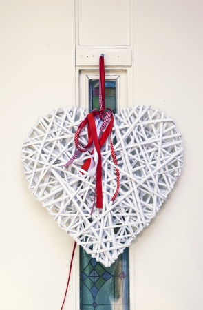 decorative heart by entrance doorの写真素材