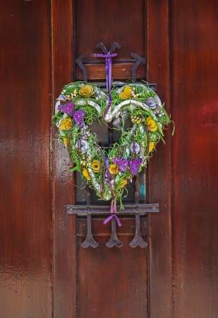decorative heart by entrance doorの写真素材