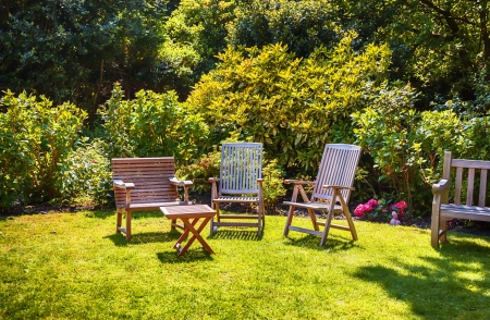 summer garden with wooden furniture
