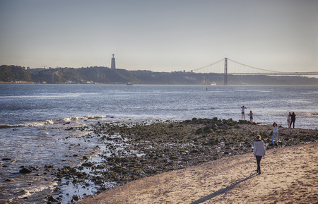 people by evening Lisbon beach city, Portugal, mart 2014 のeditorial素材