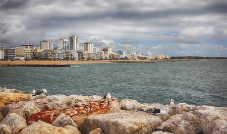 view of Vilamoura ocean coast from breakwater ( Algarve, Portugal)の写真素材