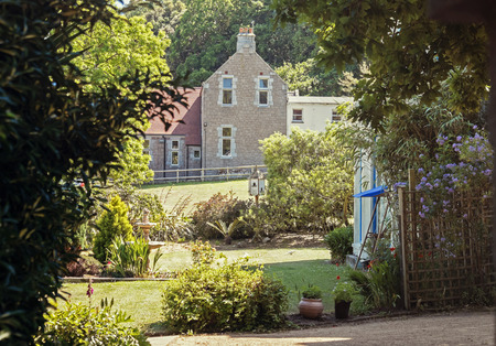 typical English garden and detail of houseの写真素材