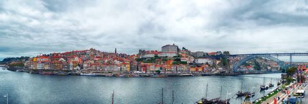 autumn panorama of the Douro river, Dom Luiz Bridge and old part of  Porto, Portugalの写真素材