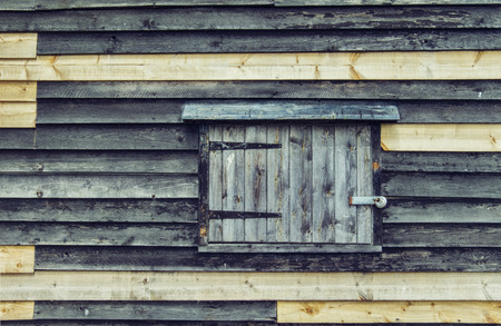 English old wooden wall with windowの写真素材