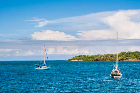 Sailboats anchored in front of the island of Bocas, Panamaのeditorial素材