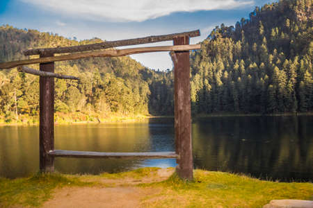 detail of wooden arch next to lakeの写真素材