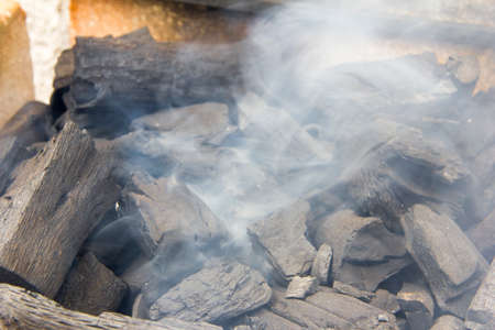bonfire of coal, fire, smokeの写真素材