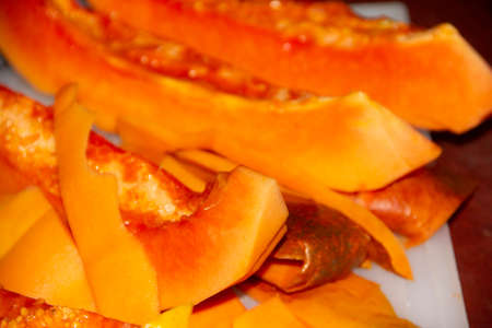 Papaya fruit germinating its seeds insideの写真素材