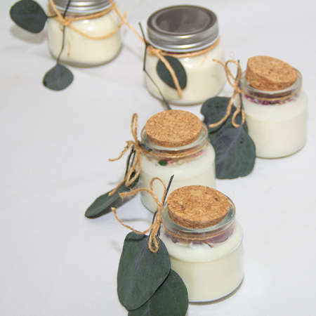 scented candles in glass jar with decorative elementsの写真素材