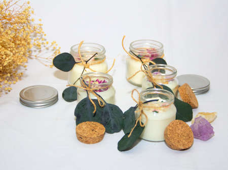 scented candles in glass jar with decorative elementsの写真素材