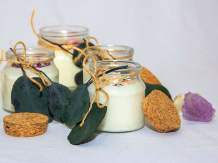 scented candles in glass jar with decorative elementsの写真素材
