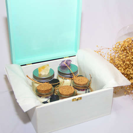 scented candles in glass jar with decorative elementsの写真素材