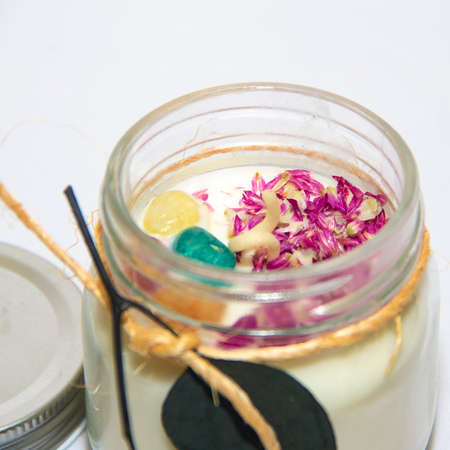 scented candles in glass jar with decorative elementsの写真素材