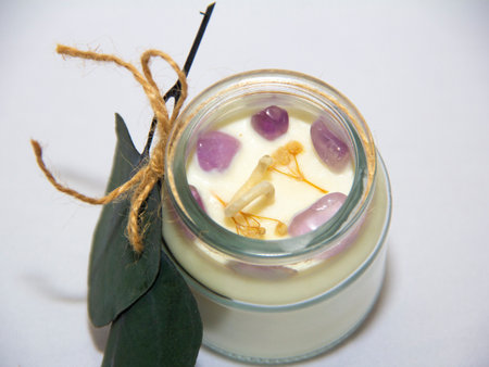scented candles in glass jar with decorative elementsの写真素材