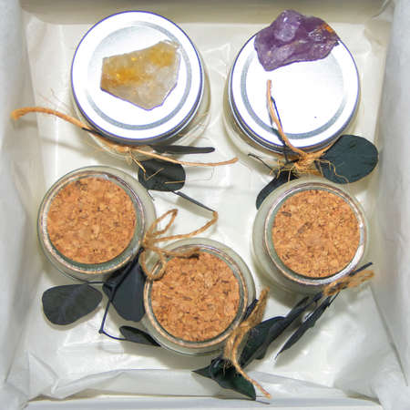 scented candles in glass jar with decorative elementsの写真素材