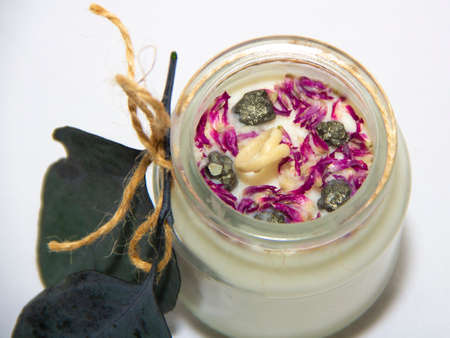 scented candles in glass jar with decorative elementsの写真素材