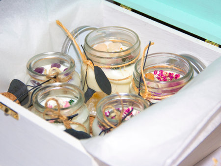 scented candles in glass jar with decorative elementsの写真素材