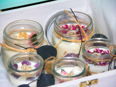 scented candles in glass jar with decorative elementsの写真素材