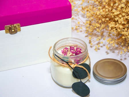 scented candles in glass jar with decorative elementsの写真素材
