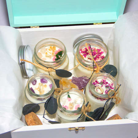 scented candles in glass jar with decorative elementsの写真素材