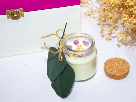 scented candles in glass jar with decorative elementsの写真素材
