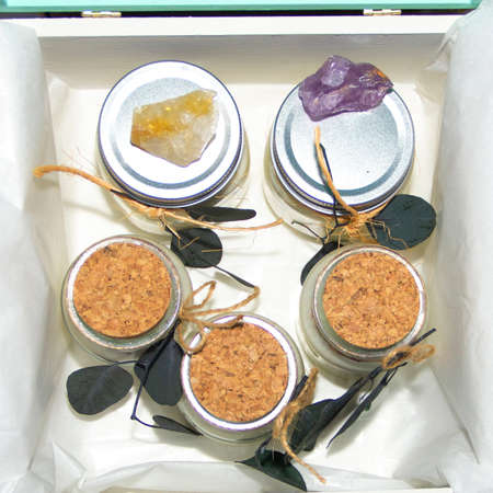 scented candles in glass jar with decorative elementsの写真素材