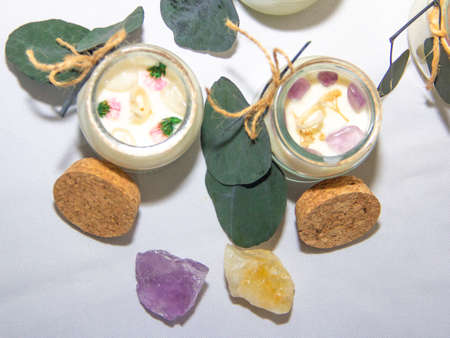 scented candles in glass jar with decorative elementsの写真素材